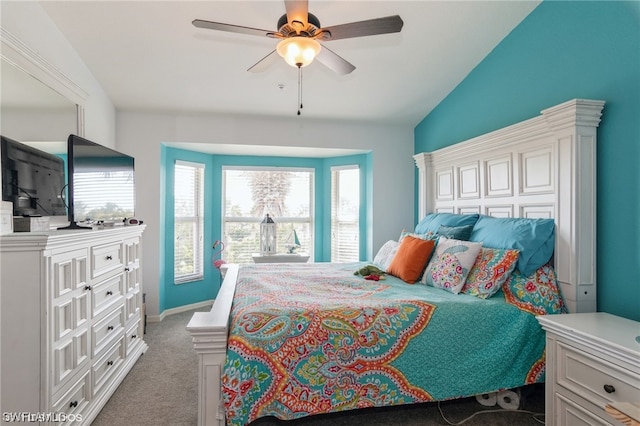 bedroom featuring carpet flooring, lofted ceiling, and ceiling fan