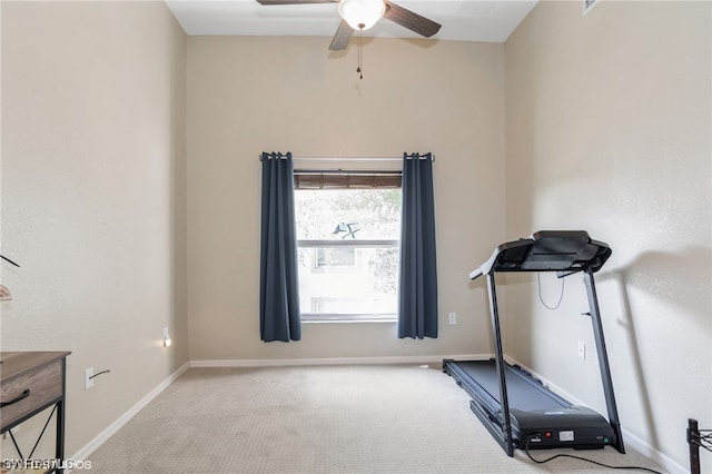 workout area with light carpet and ceiling fan