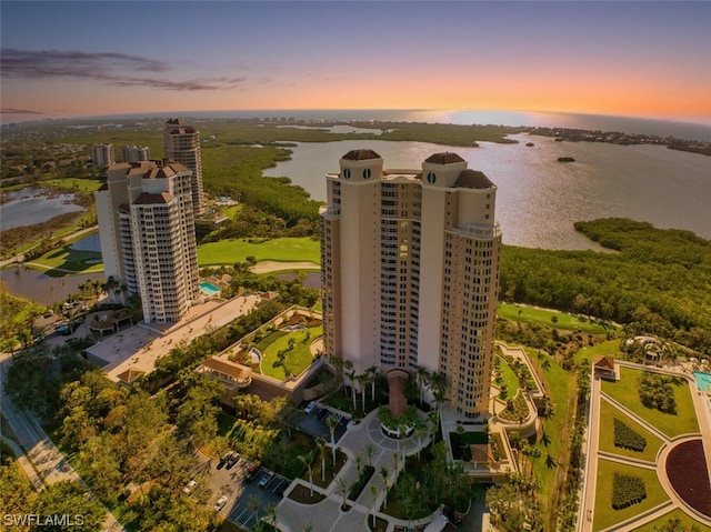 aerial view at dusk with a water view