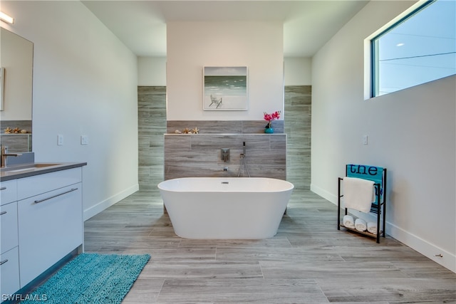 bathroom with tile walls and vanity