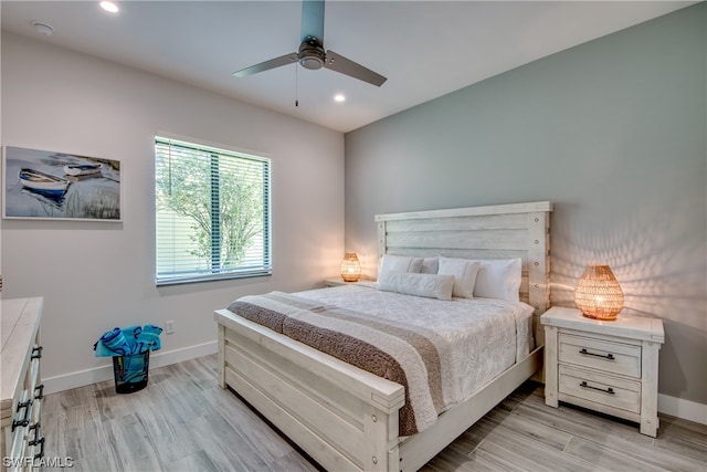 bedroom with light hardwood / wood-style flooring and ceiling fan