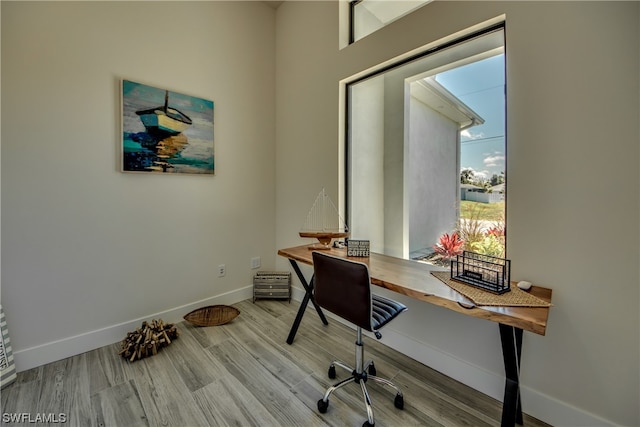 home office with light wood-type flooring