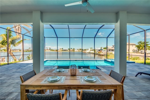 interior space with a water view and ceiling fan