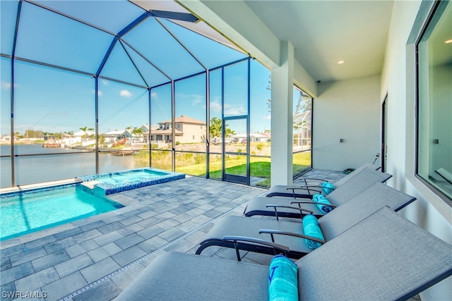 sunroom / solarium with a pool and a water view