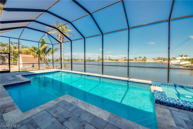 view of swimming pool with a patio and a lanai