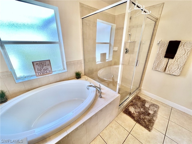 bathroom featuring tile floors and independent shower and bath