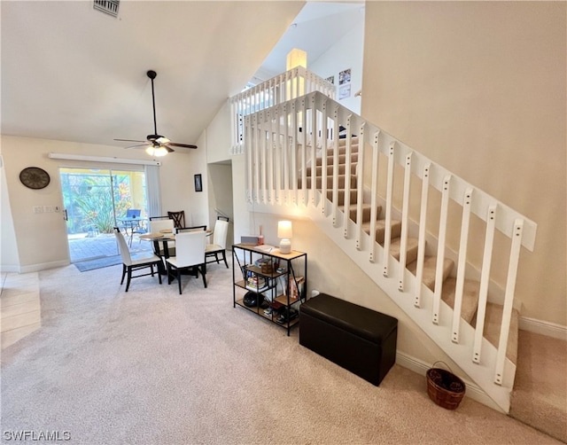 interior space featuring high vaulted ceiling and ceiling fan