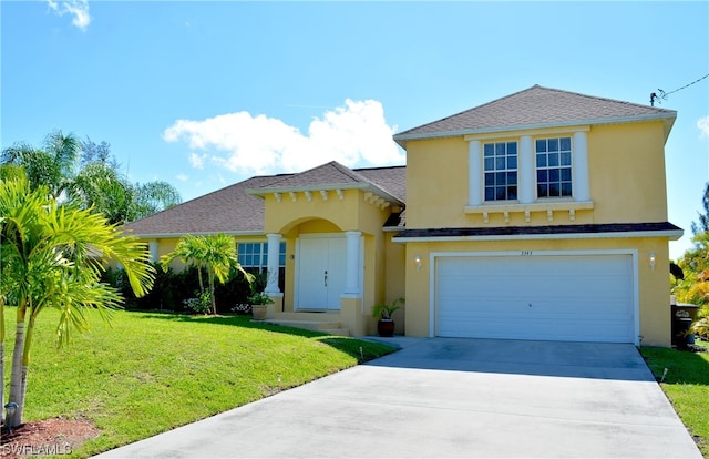 view of front of house featuring a front lawn and a garage