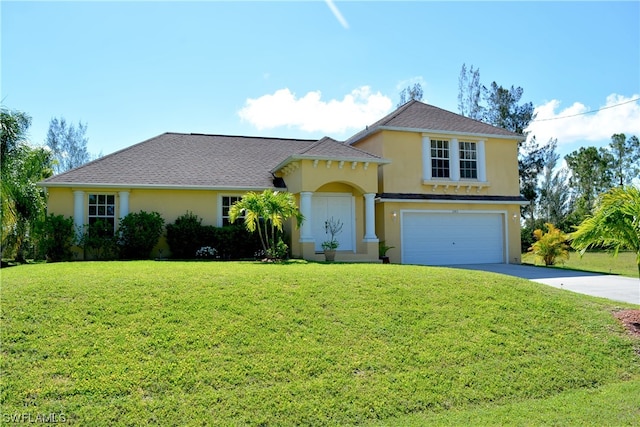 view of front of property with a front lawn and a garage