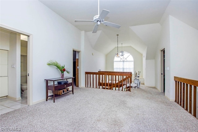 interior space featuring light carpet, a chandelier, and high vaulted ceiling