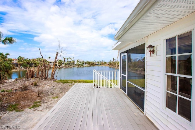 wooden deck with a water view