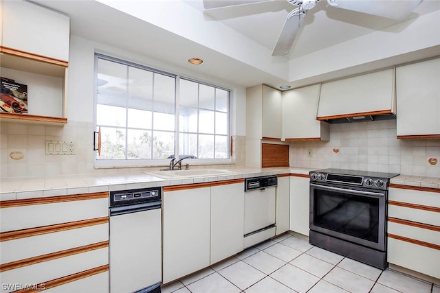 kitchen featuring white cabinetry, backsplash, dishwasher, and electric range oven