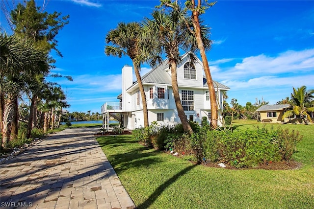 exterior space with a front lawn