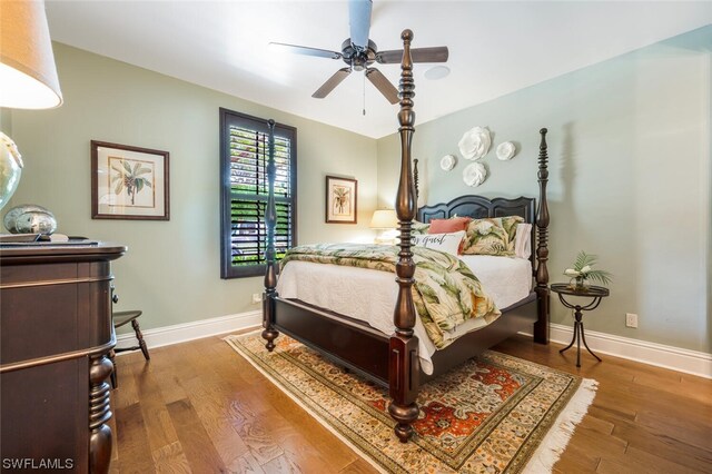 bedroom with hardwood / wood-style flooring and ceiling fan