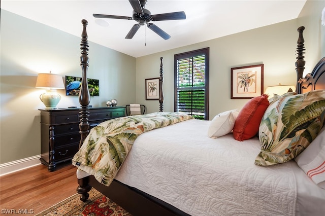 bedroom featuring hardwood / wood-style flooring and ceiling fan