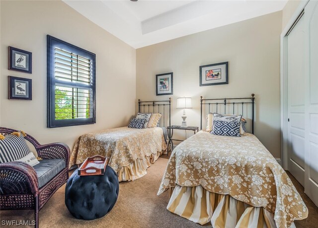 carpeted bedroom with a closet