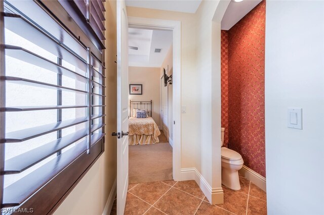 bathroom with tile patterned flooring and toilet