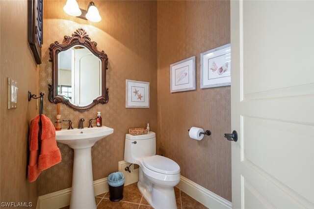 bathroom featuring tile patterned floors and toilet