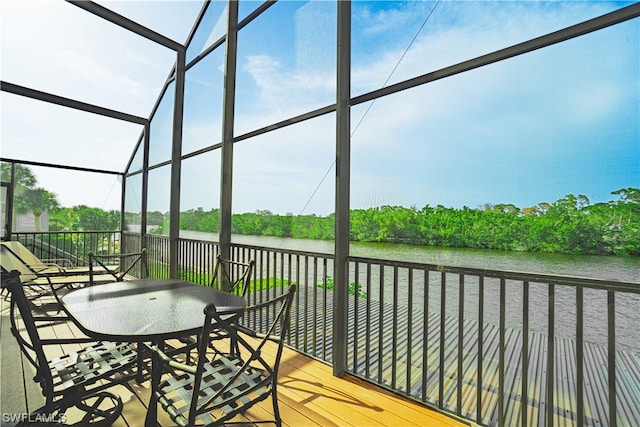 sunroom with a water view