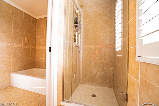 bathroom with tile walls, shower with separate bathtub, crown molding, and tile flooring