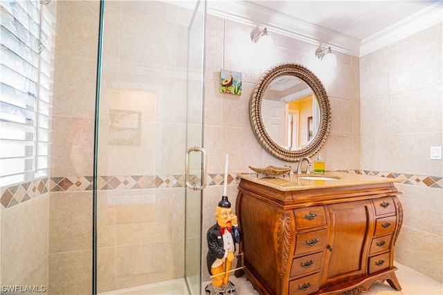 bathroom with tile walls, vanity, and crown molding