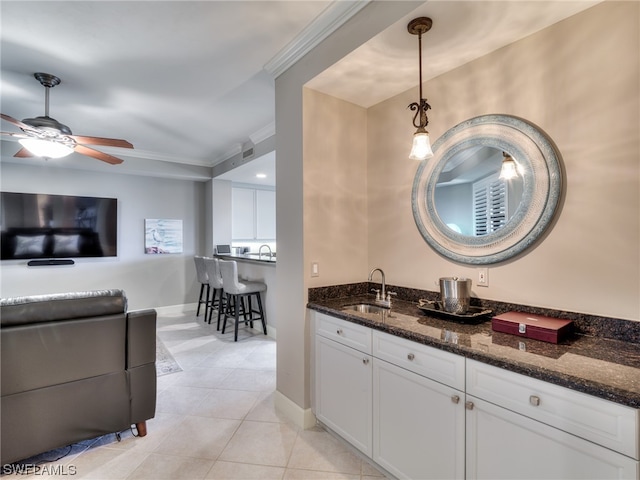 bathroom with ceiling fan, ornamental molding, tile patterned flooring, and vanity