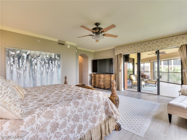 bedroom featuring ceiling fan, ornamental molding, access to exterior, and light hardwood / wood-style flooring