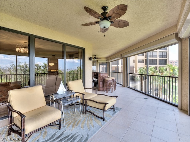 sunroom with ceiling fan