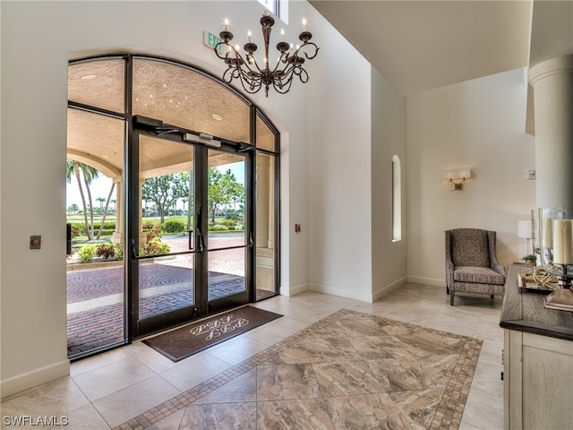 interior space featuring light tile patterned floors and a notable chandelier