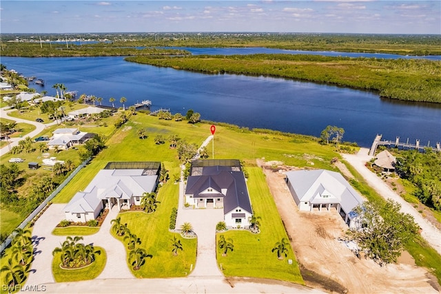 birds eye view of property with a water view