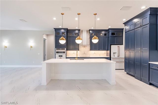 kitchen with an island with sink, tasteful backsplash, light tile flooring, and wall chimney exhaust hood