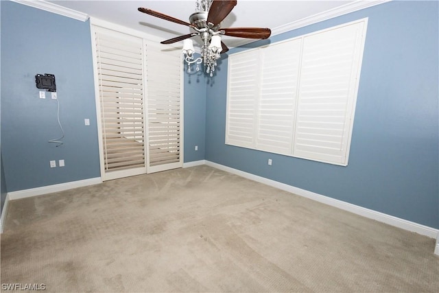 unfurnished bedroom with light carpet, access to exterior, ornamental molding, and ceiling fan