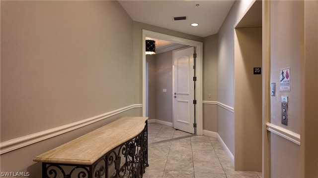 hallway featuring light tile patterned flooring