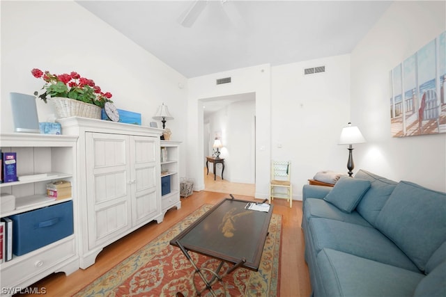 living room with ceiling fan and light wood-type flooring