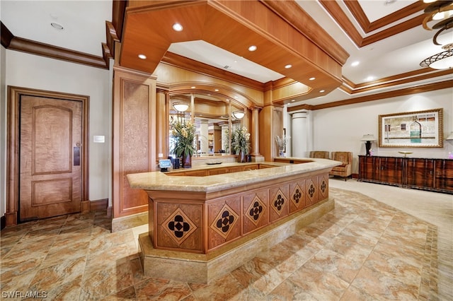 interior space with vanity, ornate columns, and ornamental molding