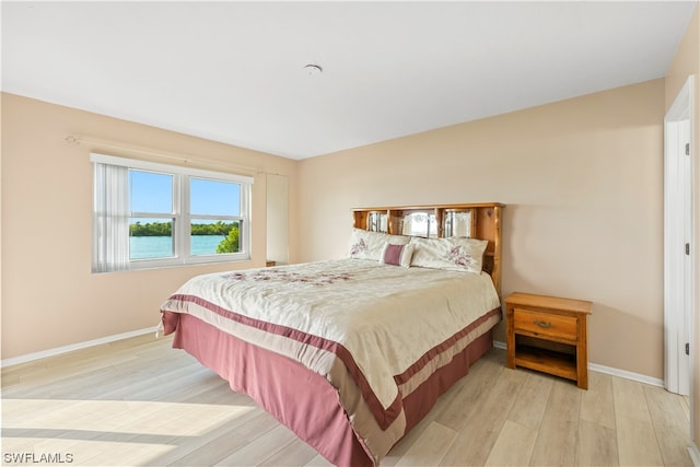 bedroom with light hardwood / wood-style flooring