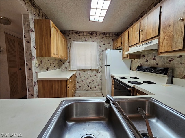 kitchen featuring white electric range, tile floors, a textured ceiling, and sink