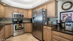 6672 Estero Blvd Unit A907, Fort Myers Beach, FL 33931 - kitchen featuring light tile floors, tasteful backsplash, appliances with stainless steel finishes, crown molding, and a raised ceiling