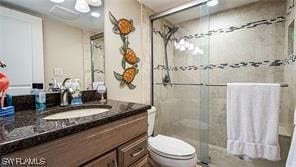 6672 Estero Blvd Unit A907, Fort Myers Beach, FL 33931 - bathroom with toilet, a shower with door, and vanity
