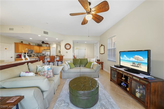 tiled living room with ceiling fan