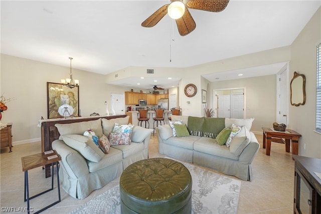 living room featuring ceiling fan with notable chandelier and light tile floors