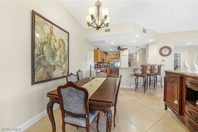 dining space with ceiling fan with notable chandelier and light tile floors