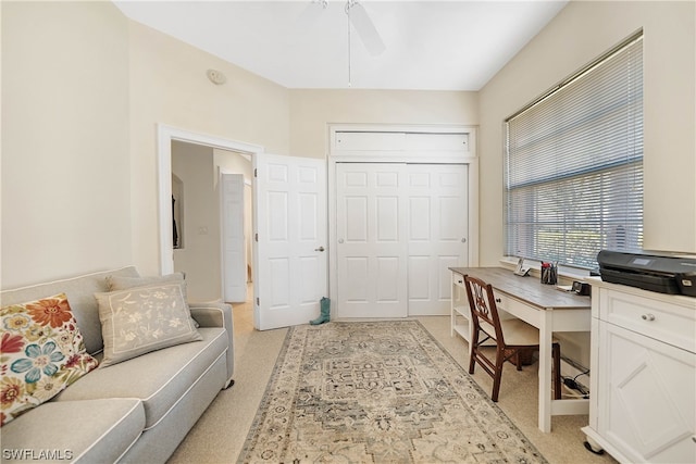 office with light colored carpet and ceiling fan