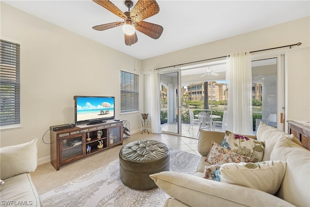 tiled living room with ceiling fan