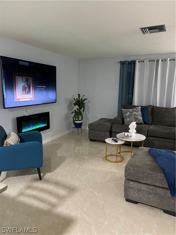 living room featuring a textured ceiling