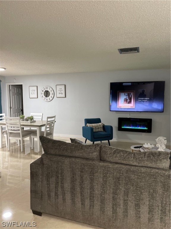 living room with a textured ceiling