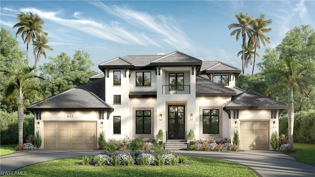 view of front of home with a front yard and a garage