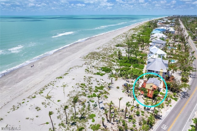 aerial view featuring a beach view and a water view