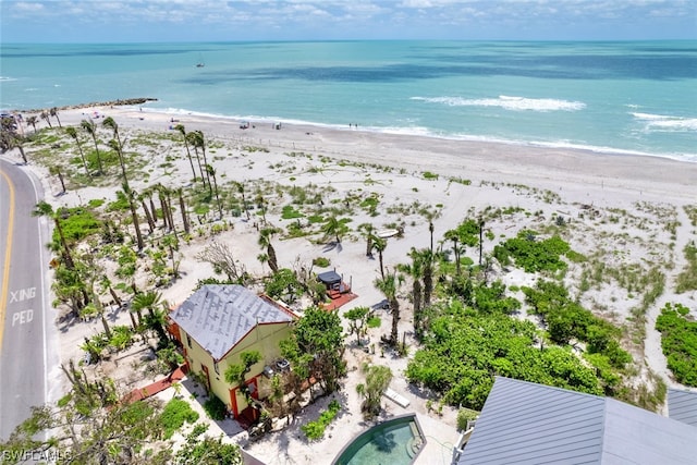 aerial view with a view of the beach and a water view