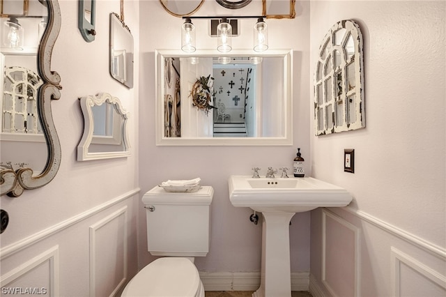 bathroom with toilet and sink